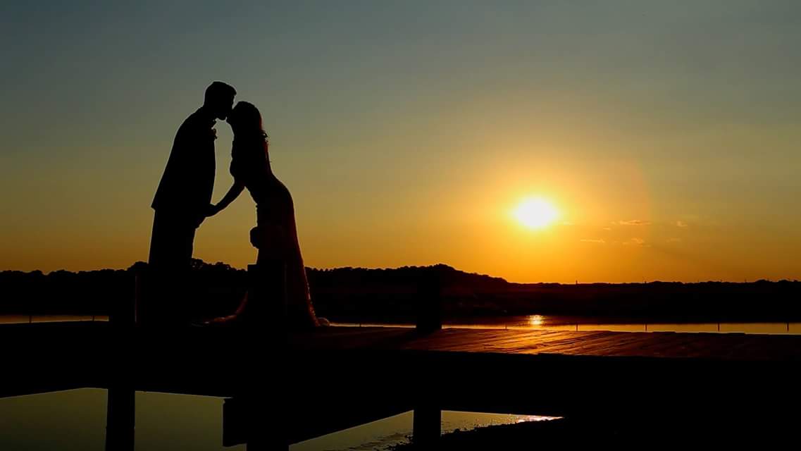 Sunset lake bride and groom